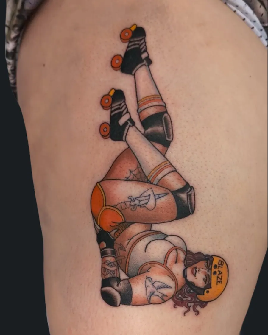 Tattoo of a roller derby pin-up wearing a helmet labeled BLAZE, roller skates, and knee and elbow pads by English Cousins, Nashville