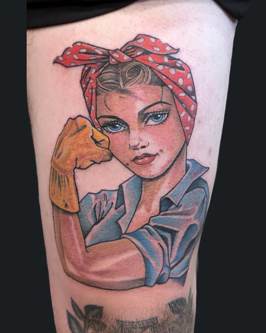 Neotraditional Rosie the Riveter pin-up tattoo, flexing in a red polka-dot bandana, on the thigh by English Cousins, Nashville