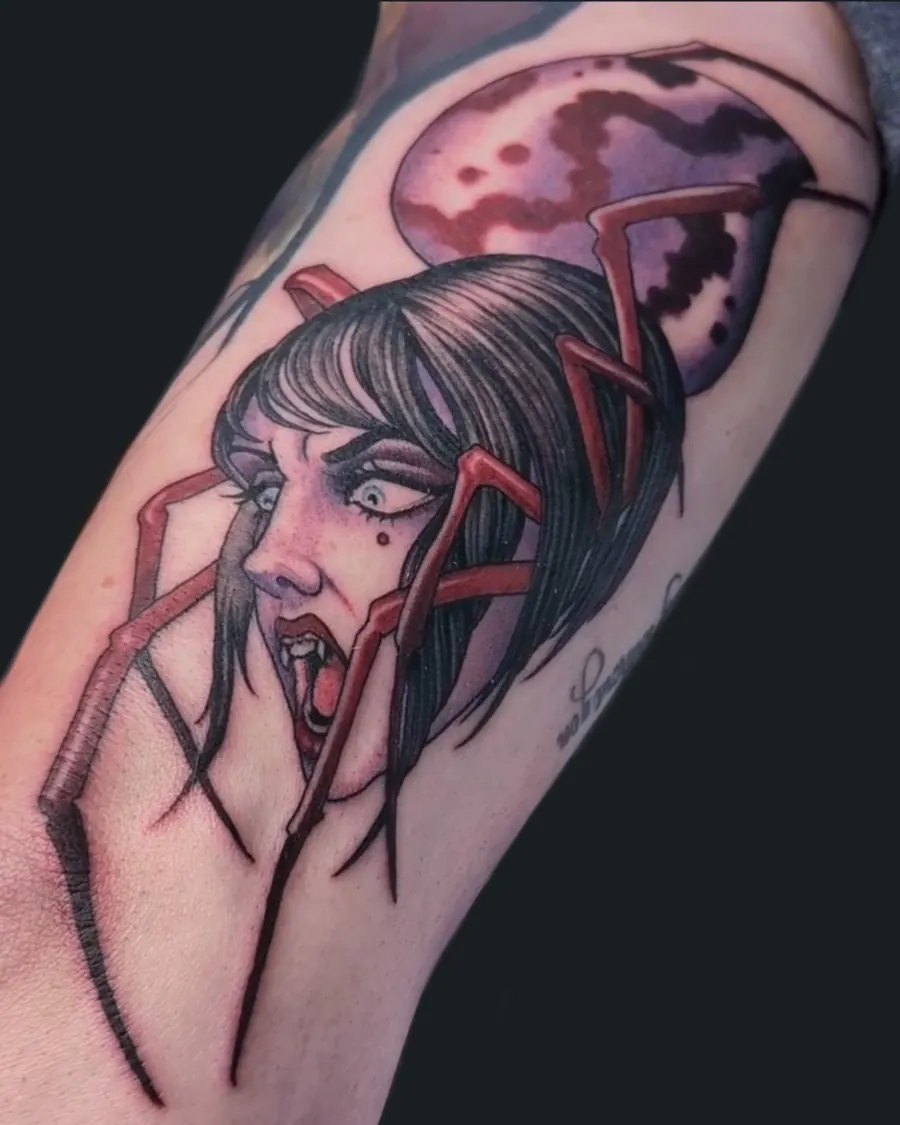 Neotraditional tattoo of a screaming woman with spider legs in front of a red moon on the inner arm by English Cousins, Nashville